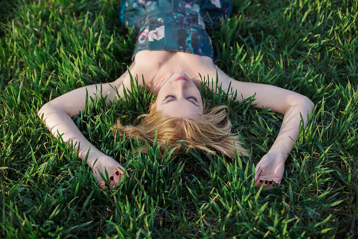 Beautiful Young Woman Lying On The Grass Del Colaborador De Stocksy Jovana Rikalo Stocksy