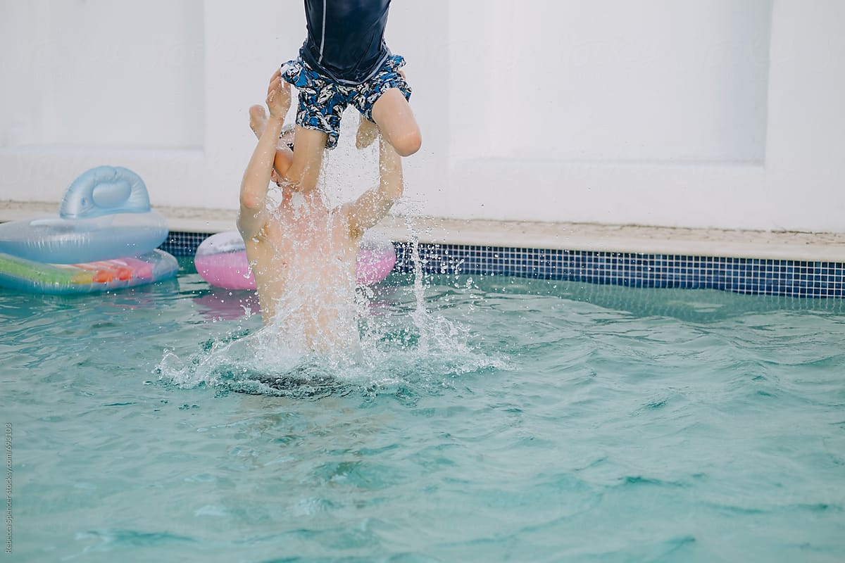 Dad Launches His Son In The Air From The Swimming Pool Del
