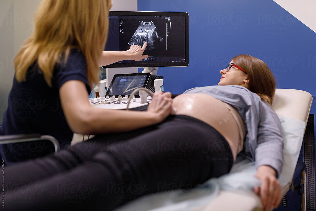 Gynecologist performing ultrasound researches