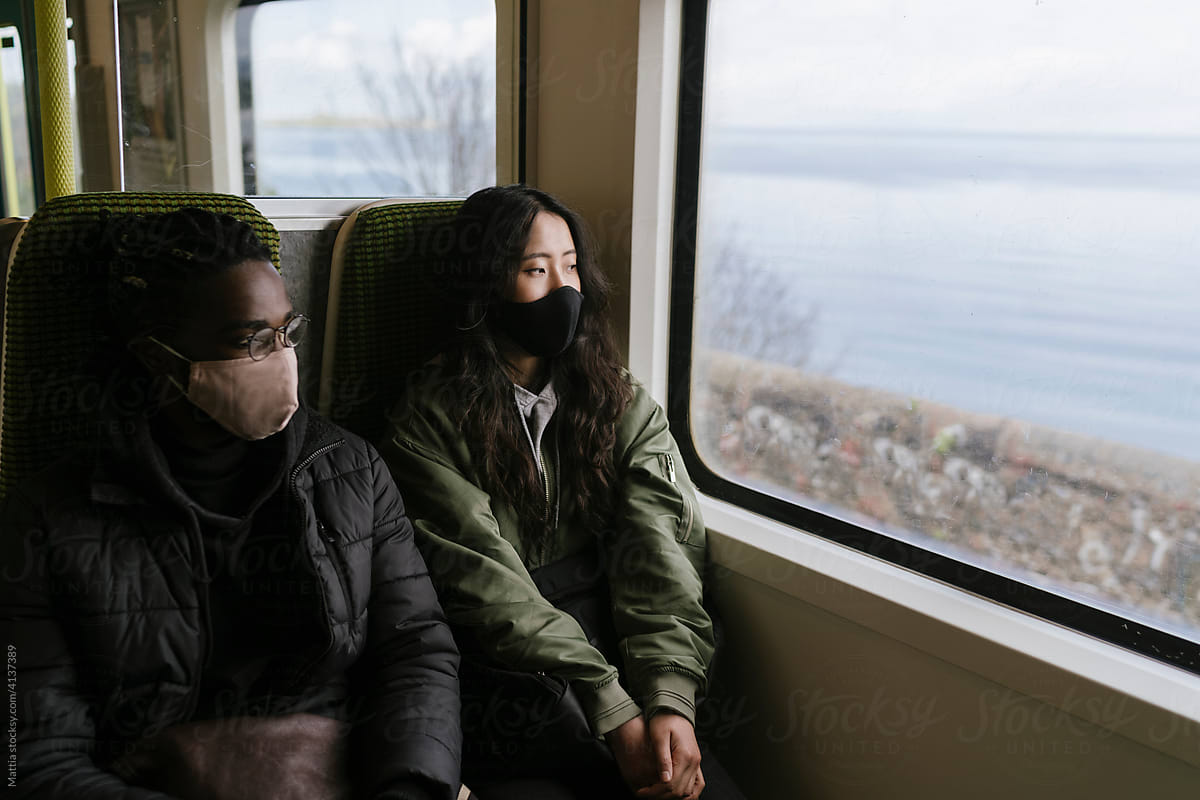 Couple Travel by Train With Face Mask