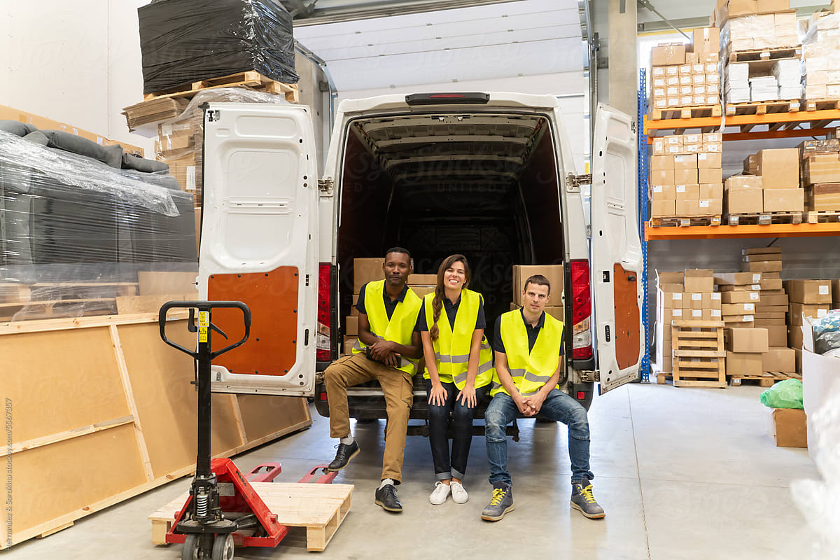 Logistic Workers Sitting At Open Delivery Van