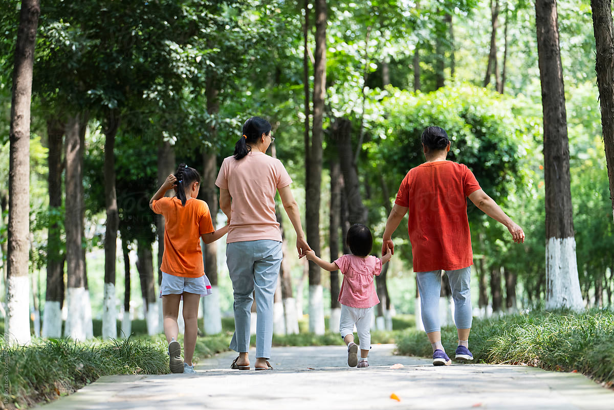 happy asian family in the park