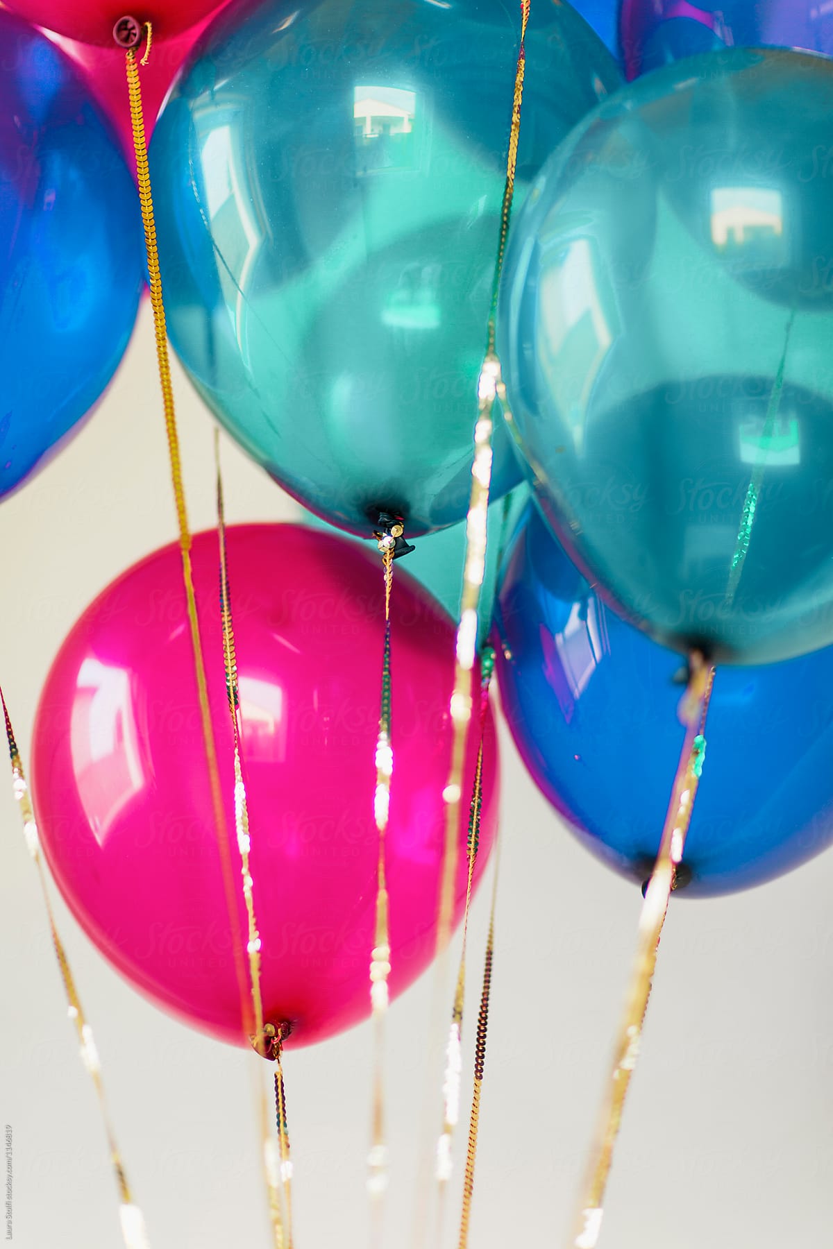 Flying Balloons And Gold Strings by Stocksy Contributor Laura Stolfi -  Stocksy