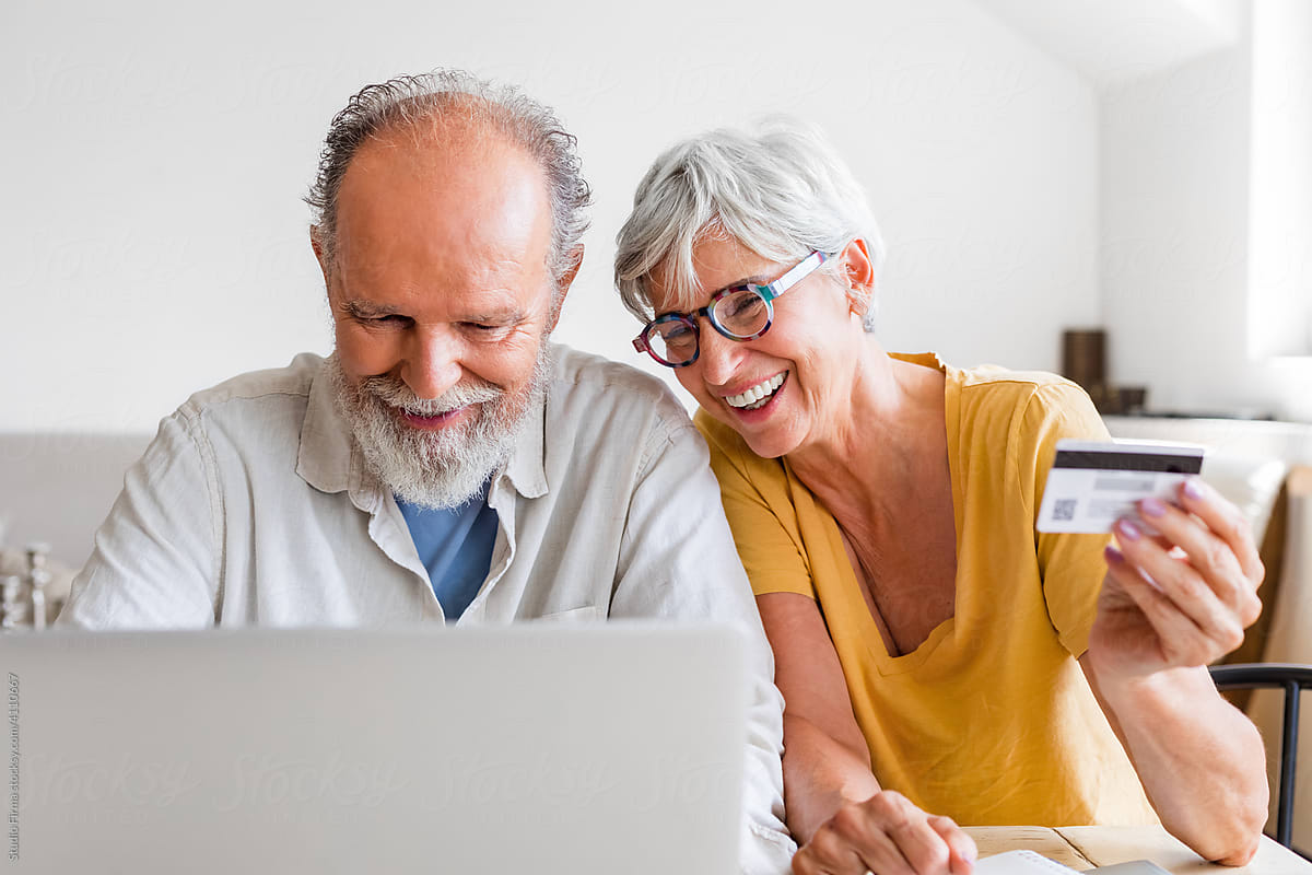 Man and Woman Using Laptop