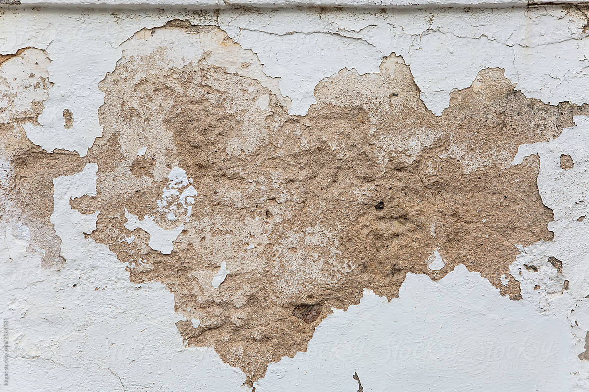 decaying plaster on white wall