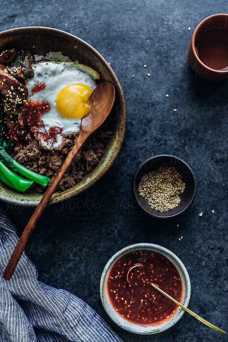 Ground beef bibimbap with mushrooms and a runny fried egg
