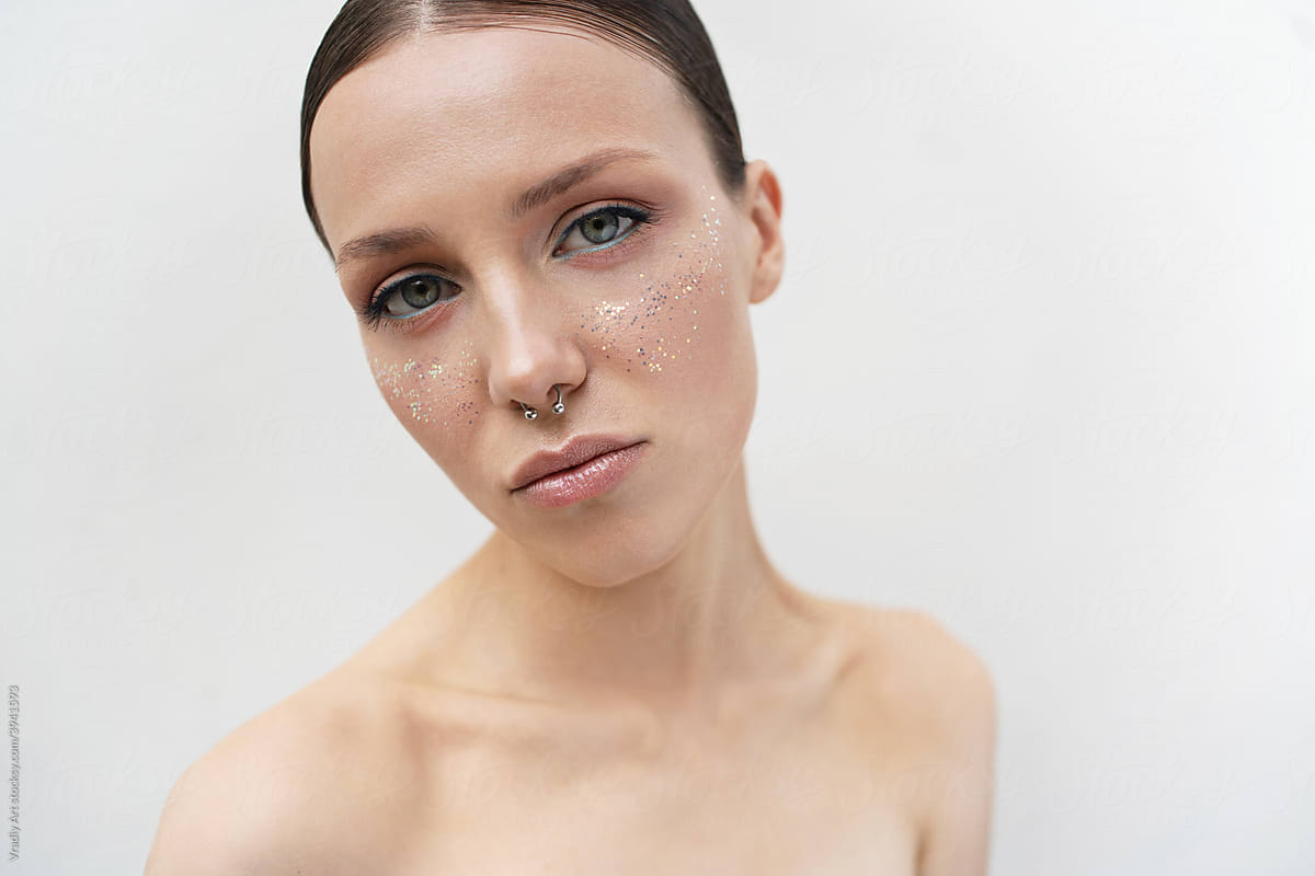 Crop model with piercing in nose on white background