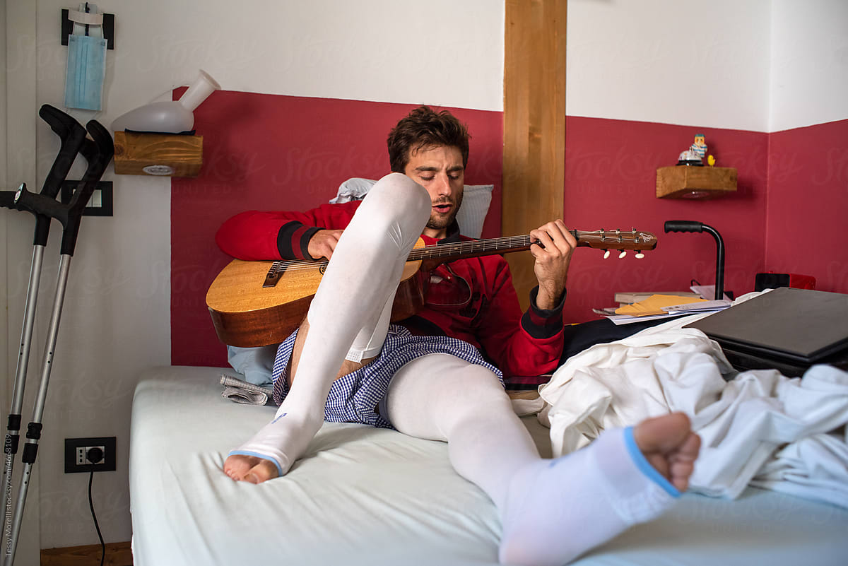 Real life injured young man with guitar