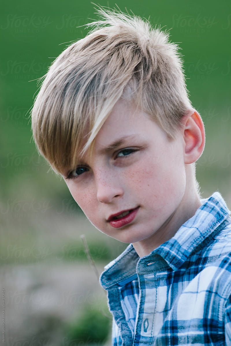 Sad Preteen Boy Sitting Outside Stock Photo - Download 