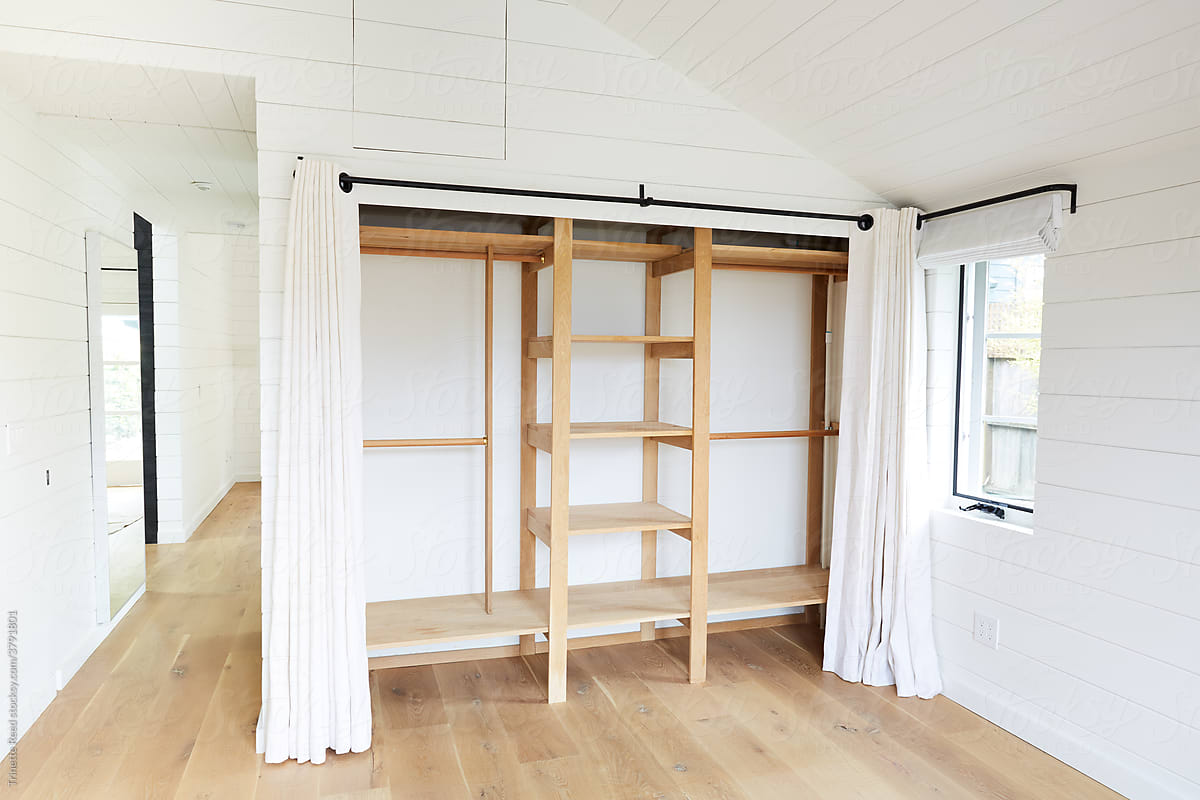 Empty closet and bedroom in farmhouse