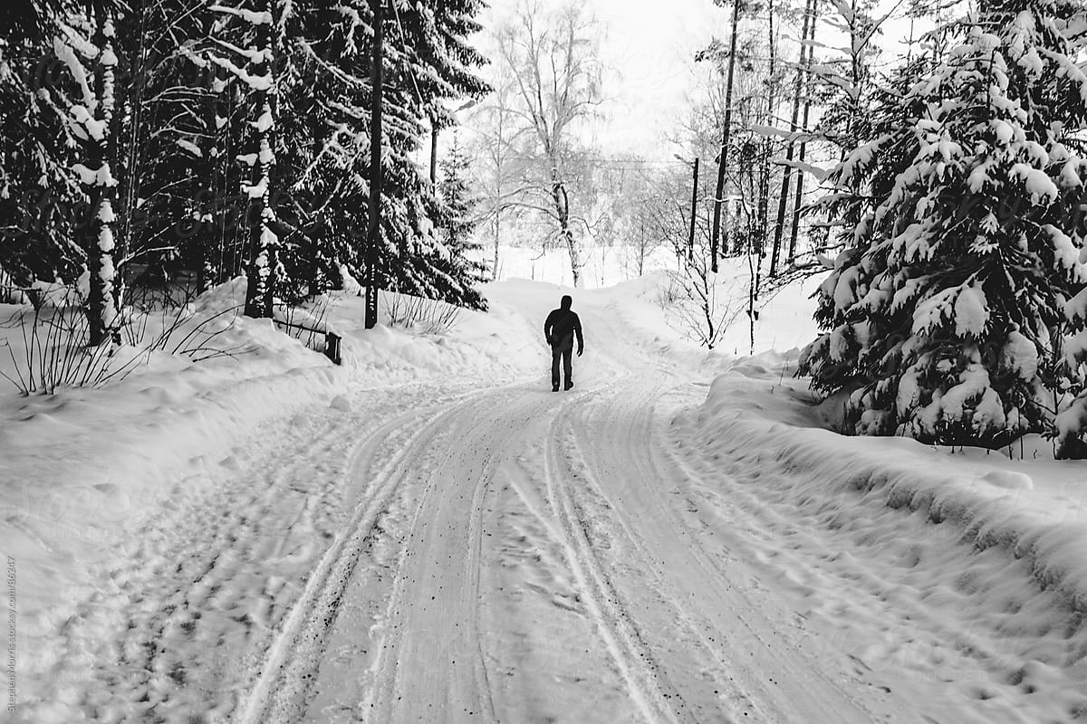 Man Walking Down Winter Road