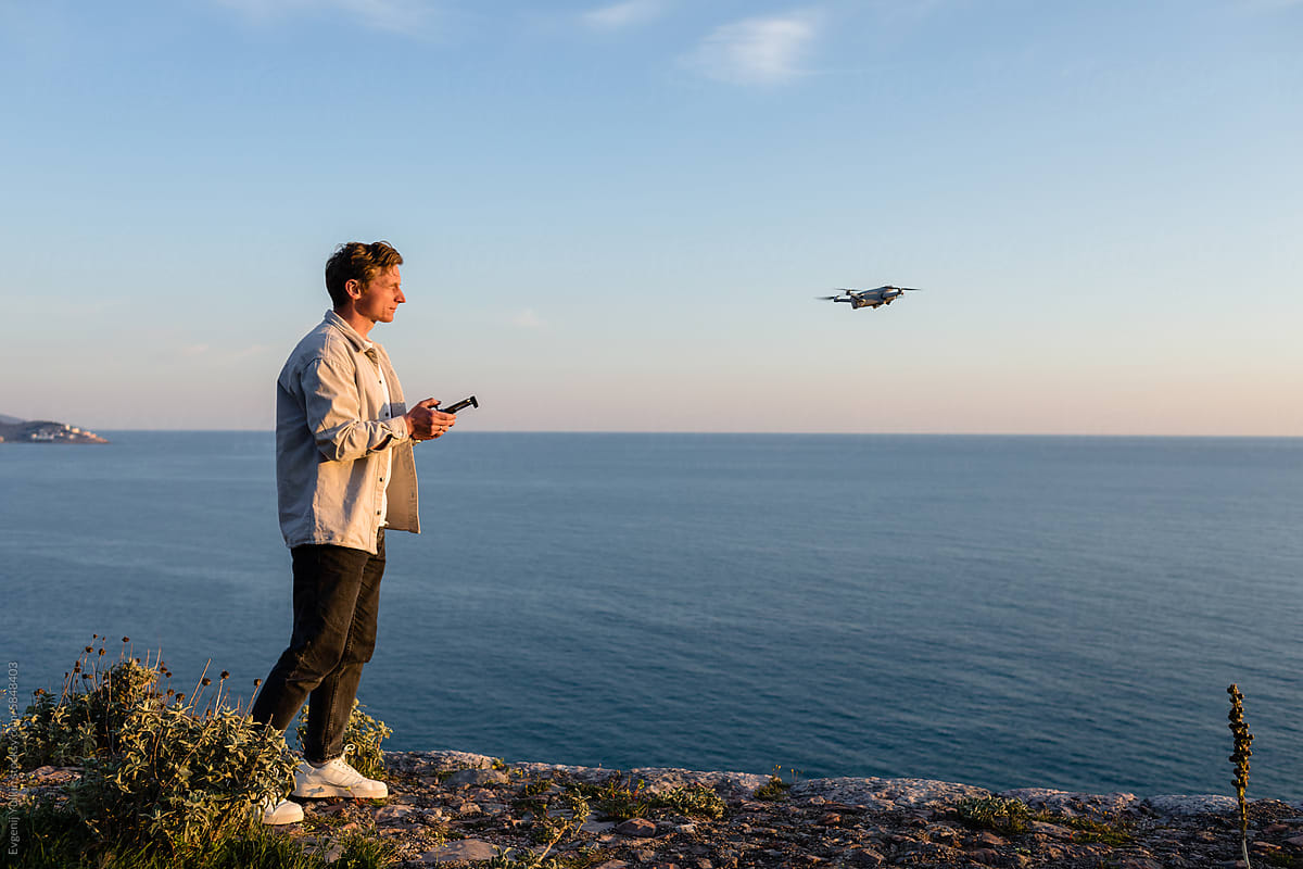 Tourist ready to explore new landscapes with the help of drone