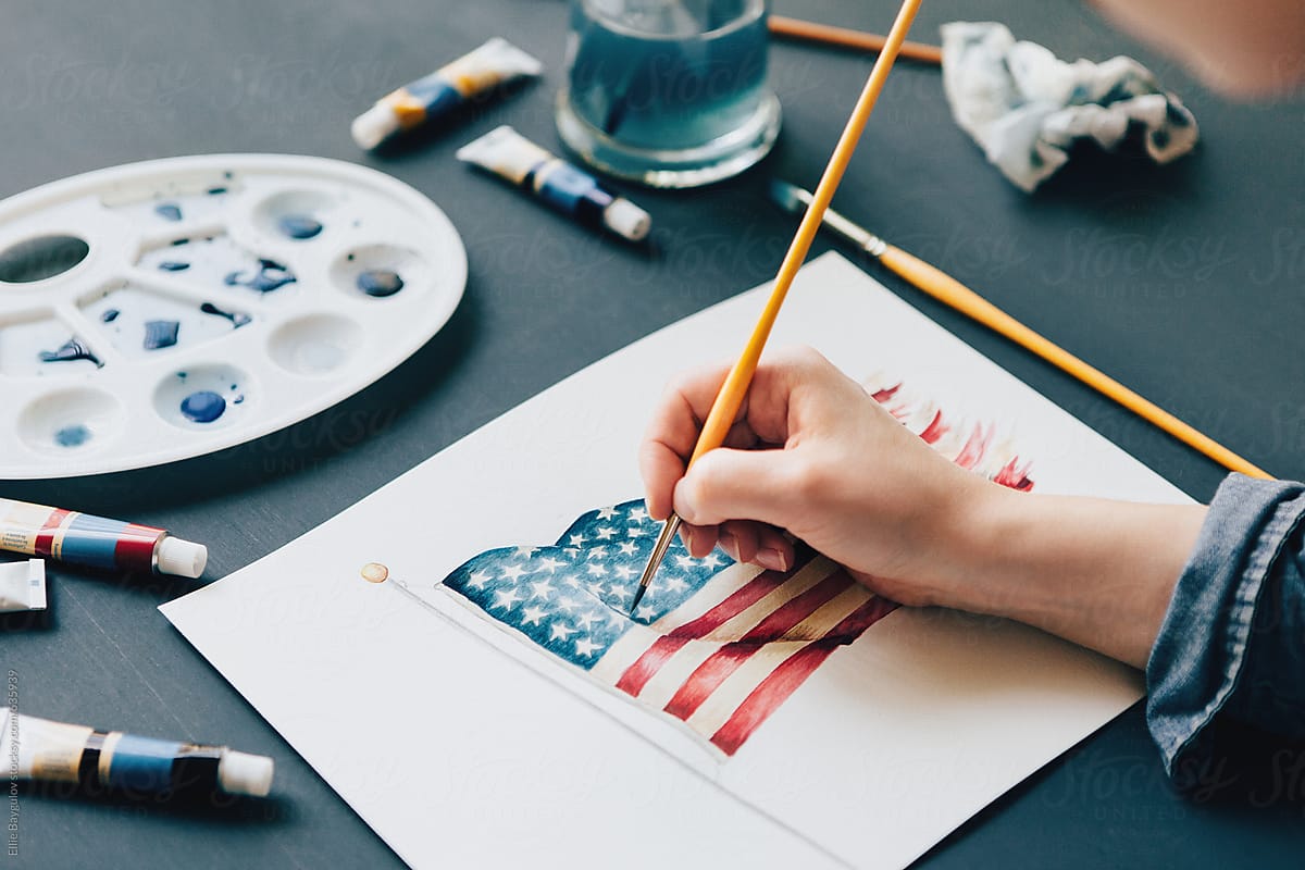 Woman painting an american flag