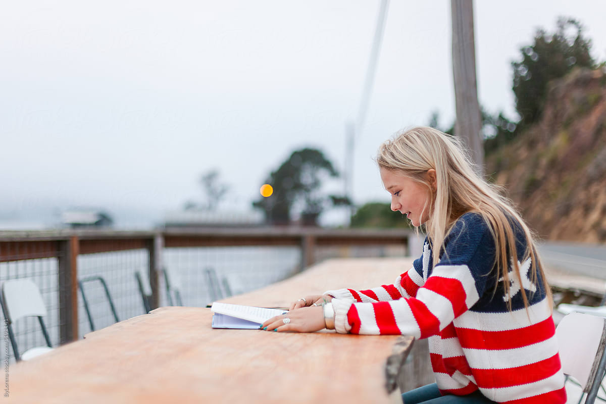 Student woman reading on the west coast