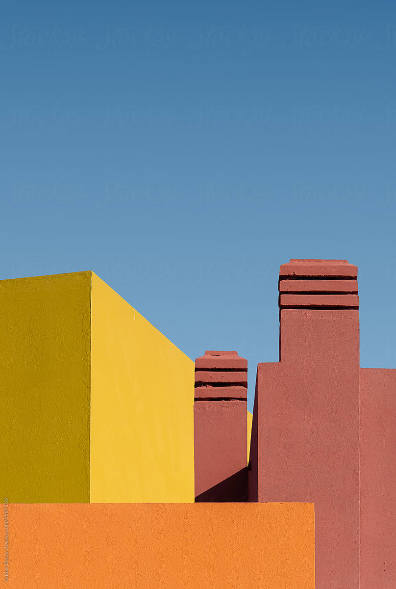 Abstract geometric shape of colorful buildings against blue sky