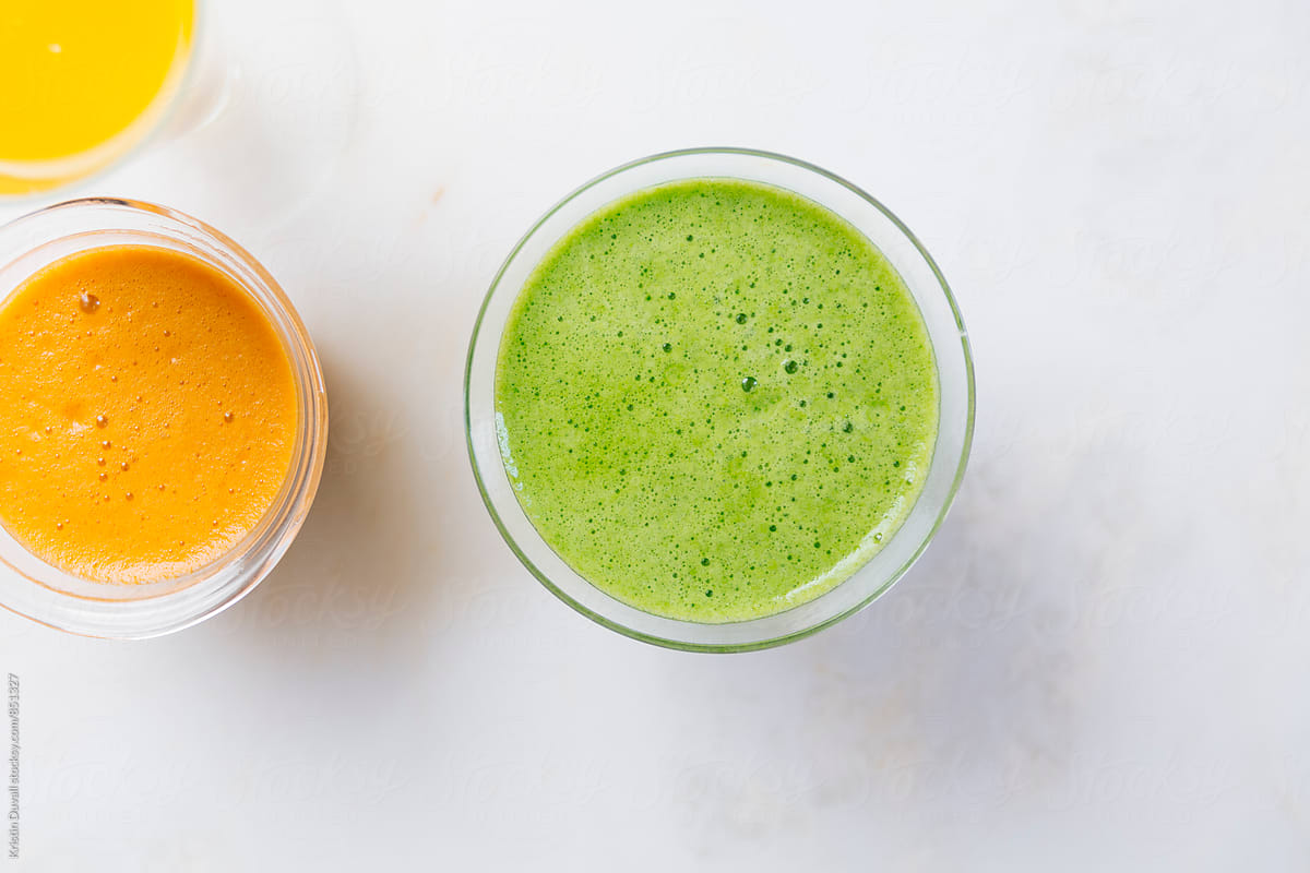Fresh green juice with citrus juices by Kristin Duvall for Stocksy United