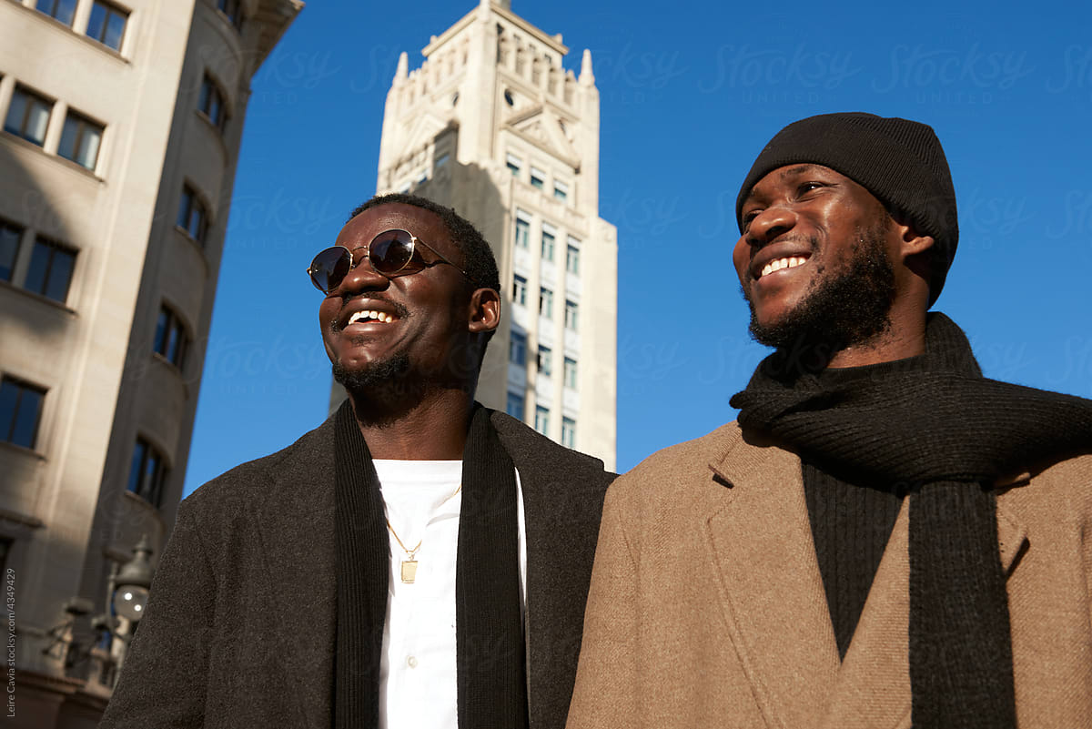 Two Happy Men friends exploring the city