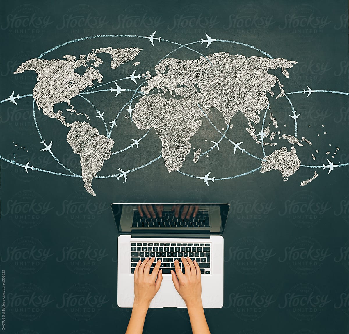 Laptop and world travel map