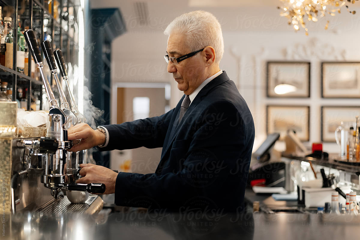 Bartender making coffee with professional equipment