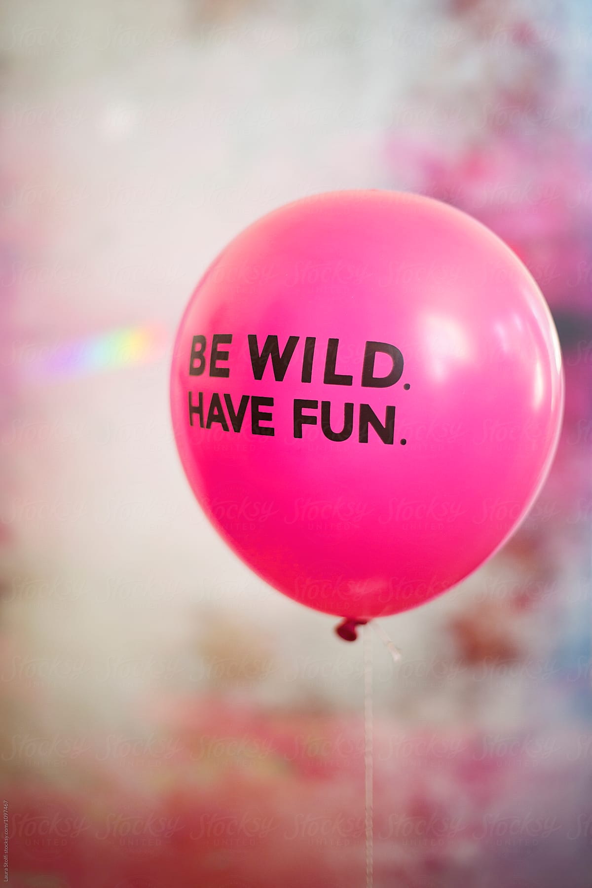 Words be wild, have fun on pink flying balloon