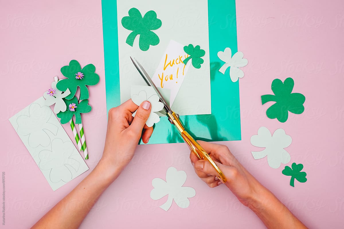 Woman Making Paper Shamrock as a Decoration for Saint Patrick's Day