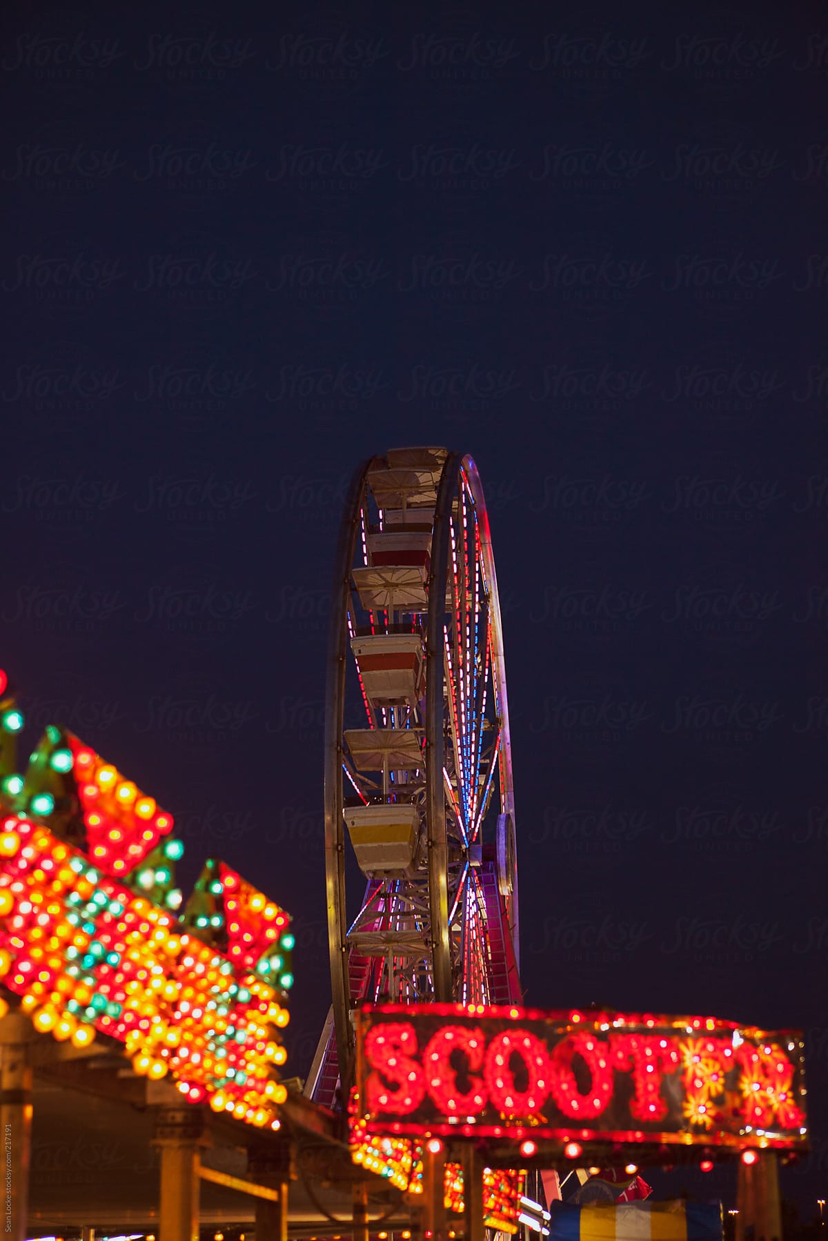 Midway: Ferris Wheel Against Darkened Sky