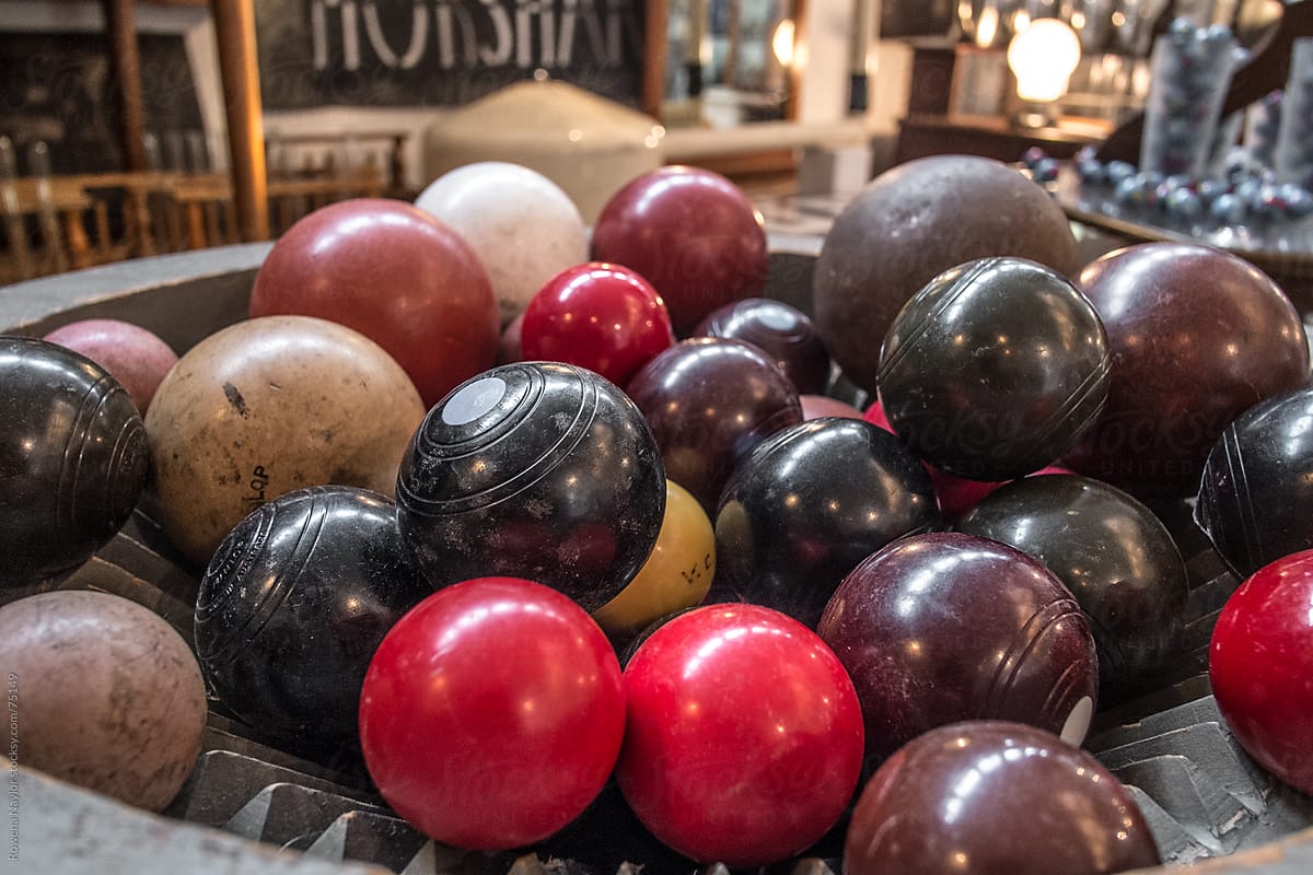 Collection Of Old Lawn Bowling Balls" by Stocksy Contributor "Rowena Naylor" - Stocksy