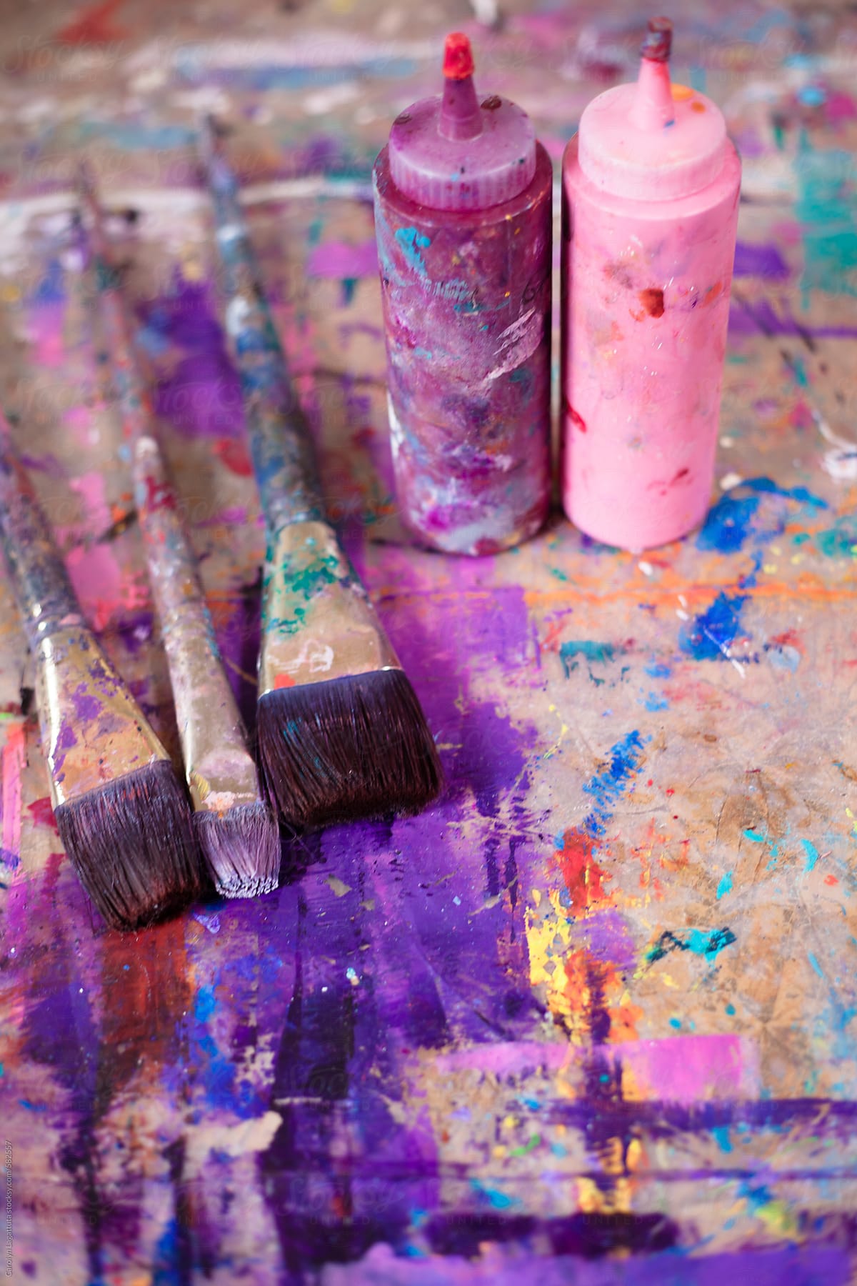 Used Paint Brushes Stained With All Colors In An Art Studio by Stocksy  Contributor Carolyn Lagattuta - Stocksy