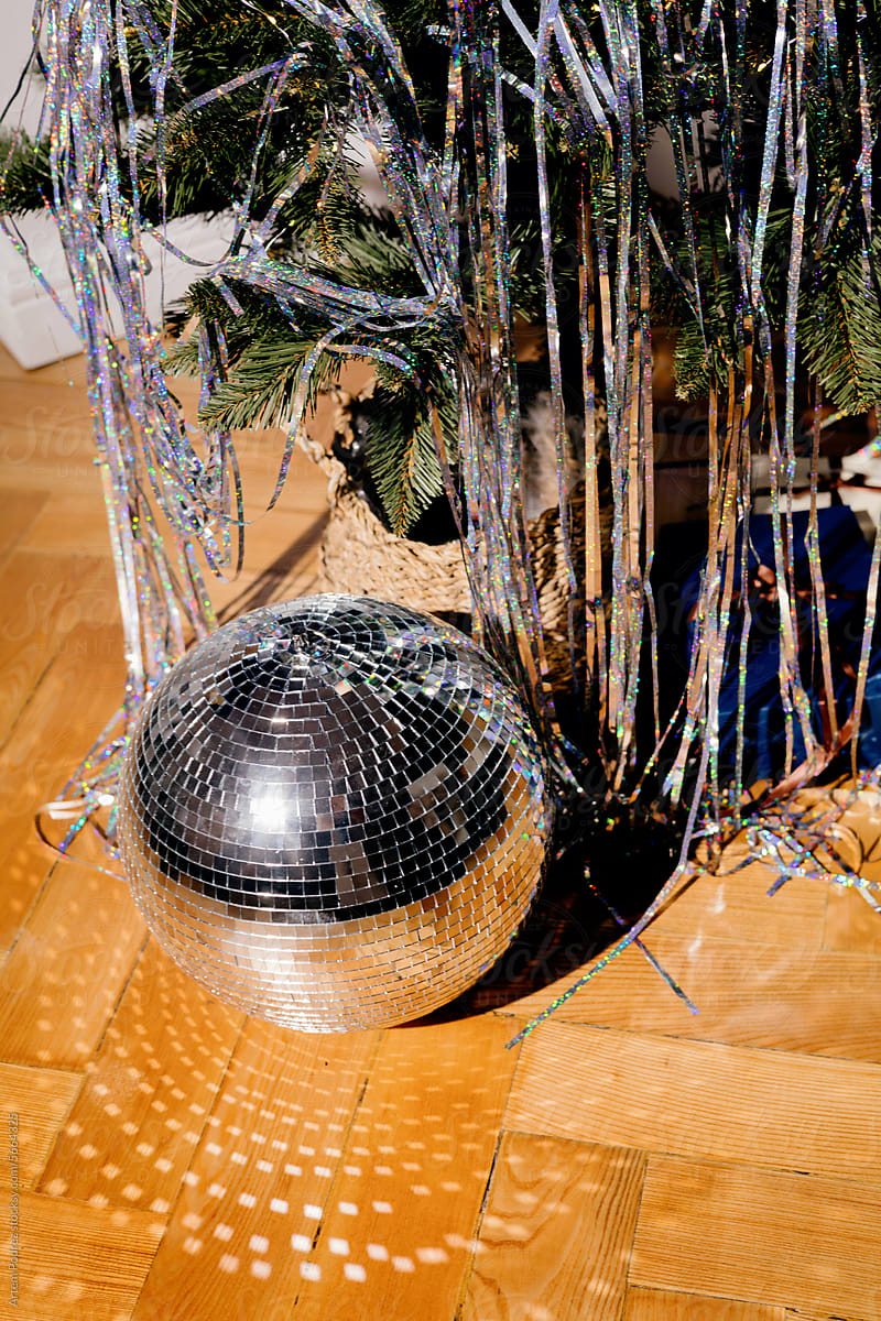 New Year\'s party mood, disco ball near the Christmas tree