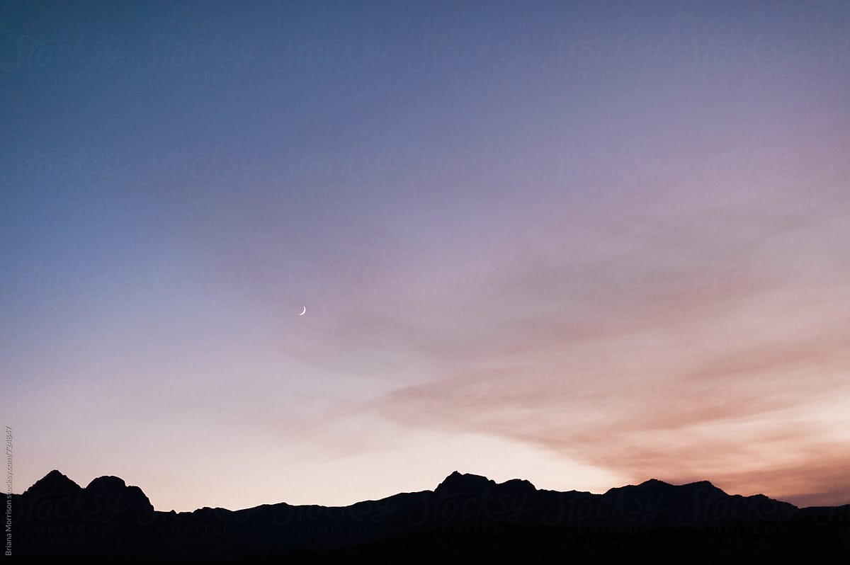 A Crescent Moon at Twilight over Desert Mountains near Las Vegas