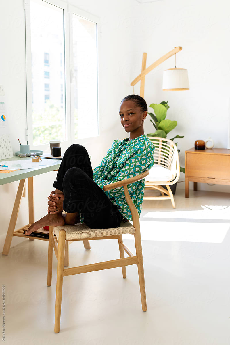 Chic African freelance woman at home office