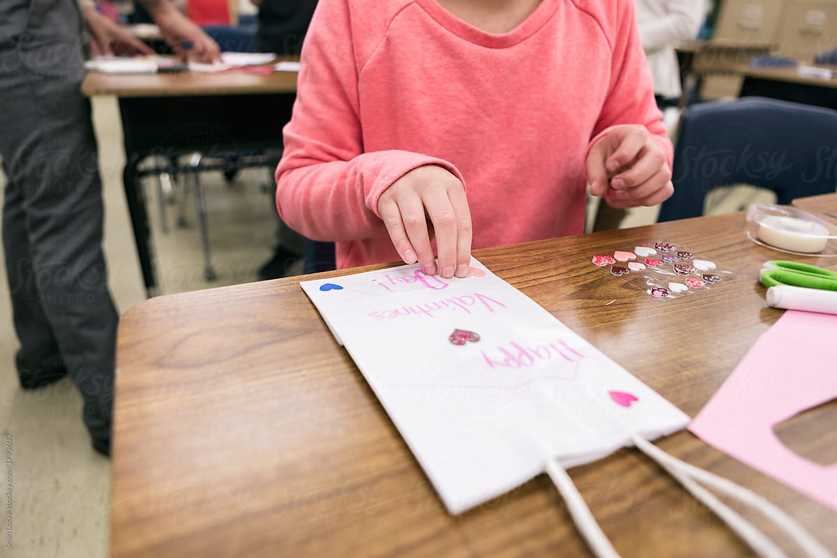 Classroom: Girl Decorates With Heart Stickers For Valentine\'s Day