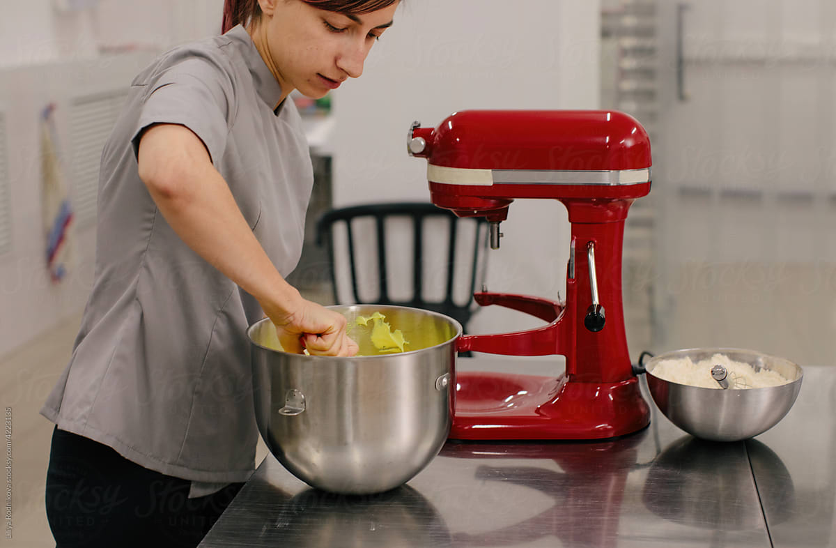 Woman mixing dough in bowl