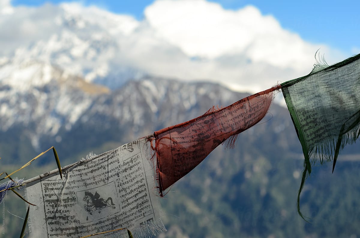 Buddhist prayer flags hanging high in mountains