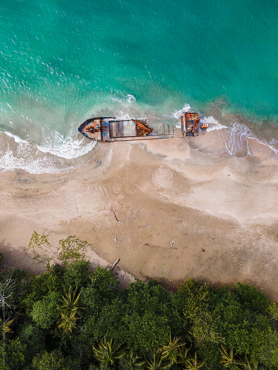 A ship stranded on the sand on the shore of the beach