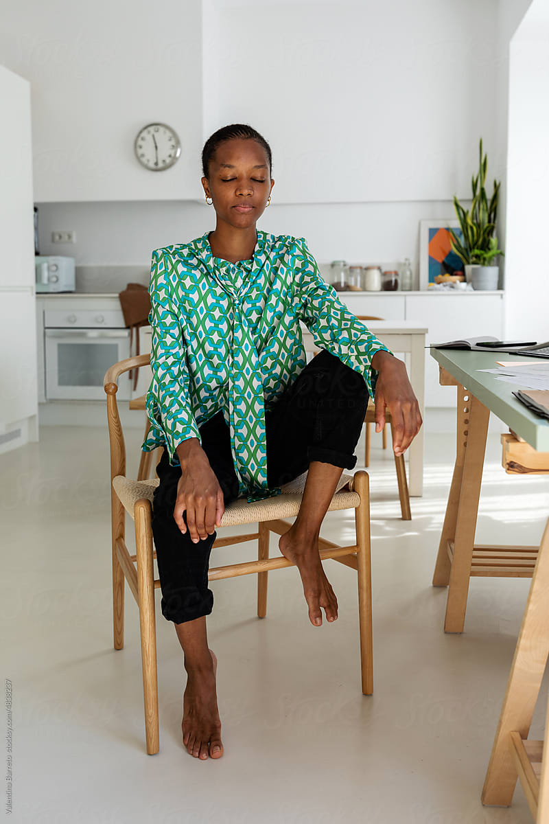 Chic African woman at home office