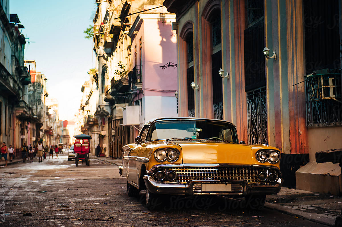 Old yellow car in the street of Havana