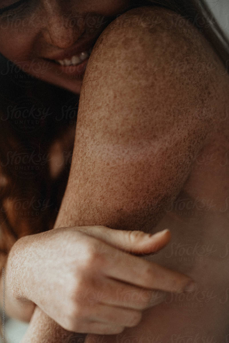 Close Up woman\'s skin texture of Ginger female with many freckles