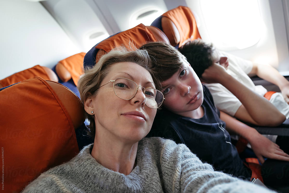 Mother and Sons on Airplane Journey
