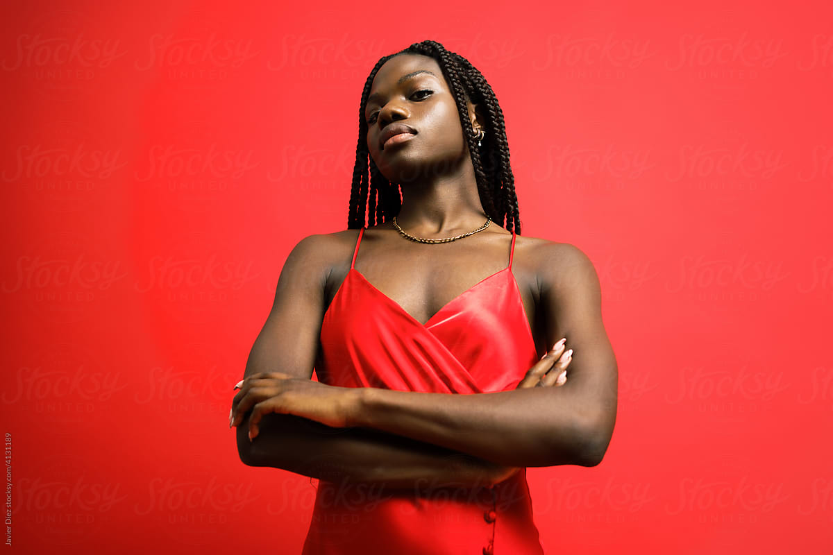 Black Woman In Classy Red Suit by Stocksy Contributor Javier Díez -  Stocksy