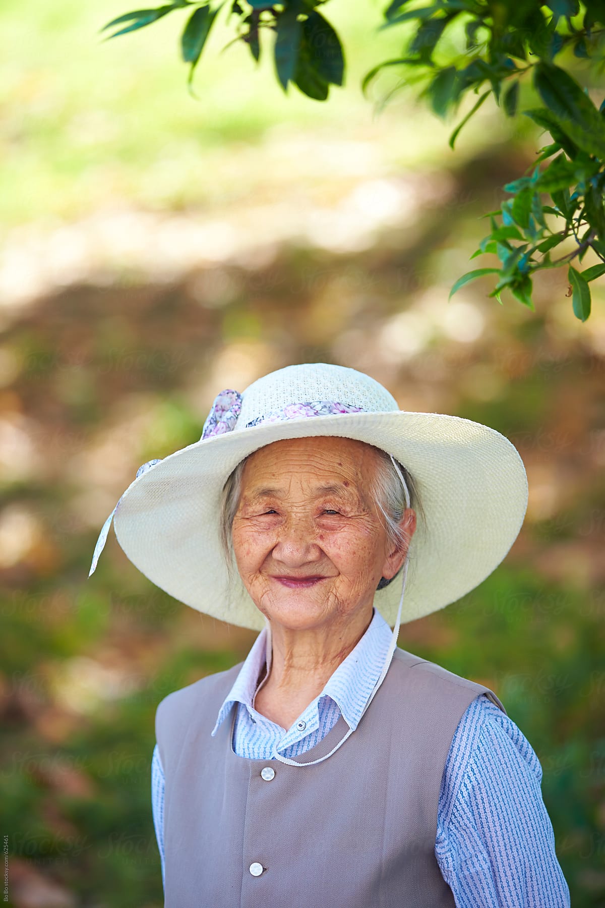 Portrait Of Senior Asian Woman Outdoor By Stocksy Contributor Bo Bo Stocksy