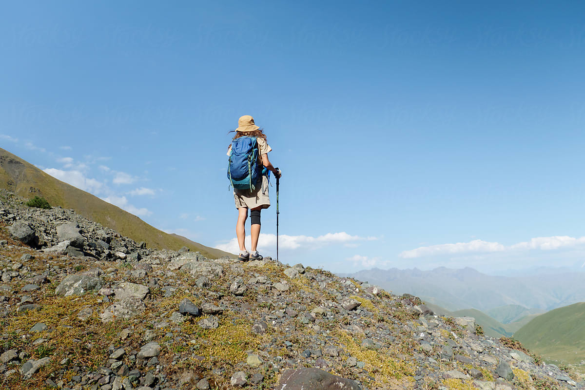 Woman hikes in an alpine mountain area