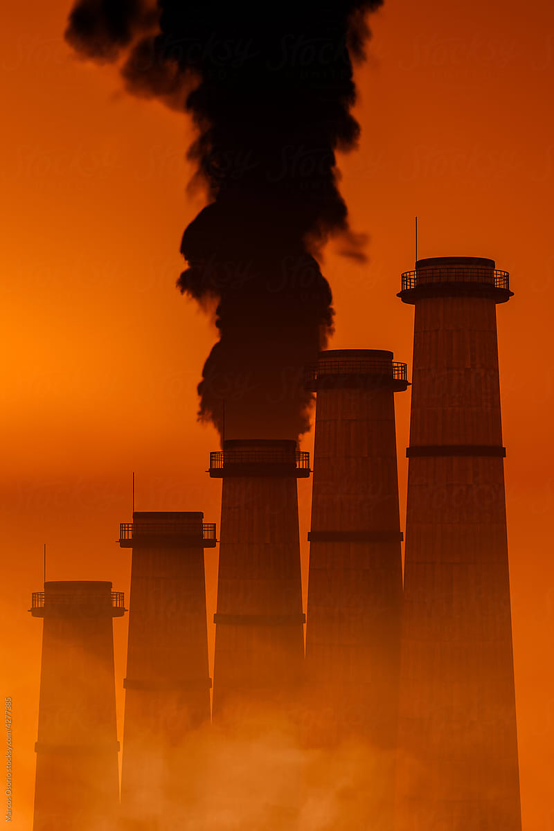 Pollution of smokestacks at sunset
