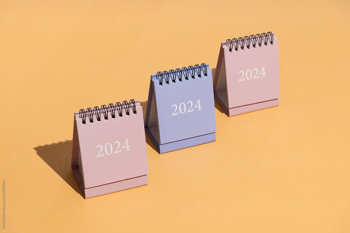 2024 calendars on orange/peach background