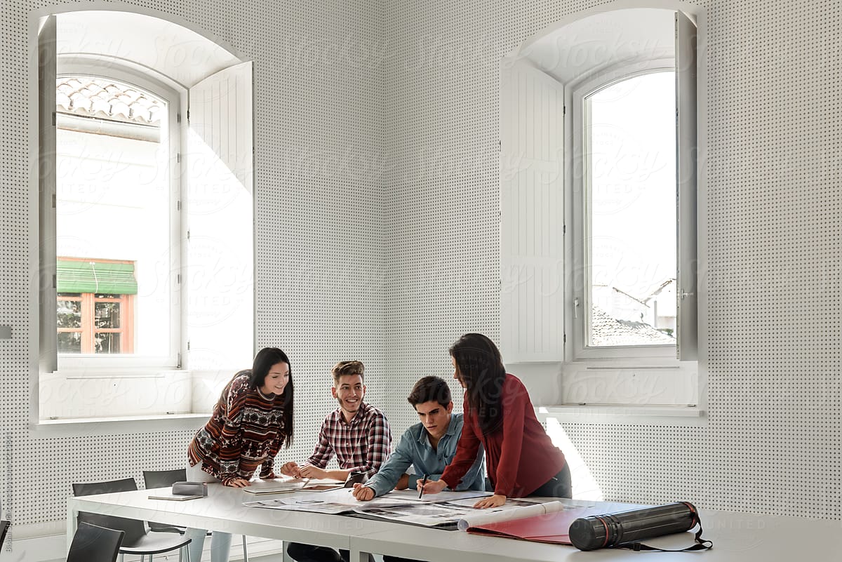 Four students of architectural department in classroom