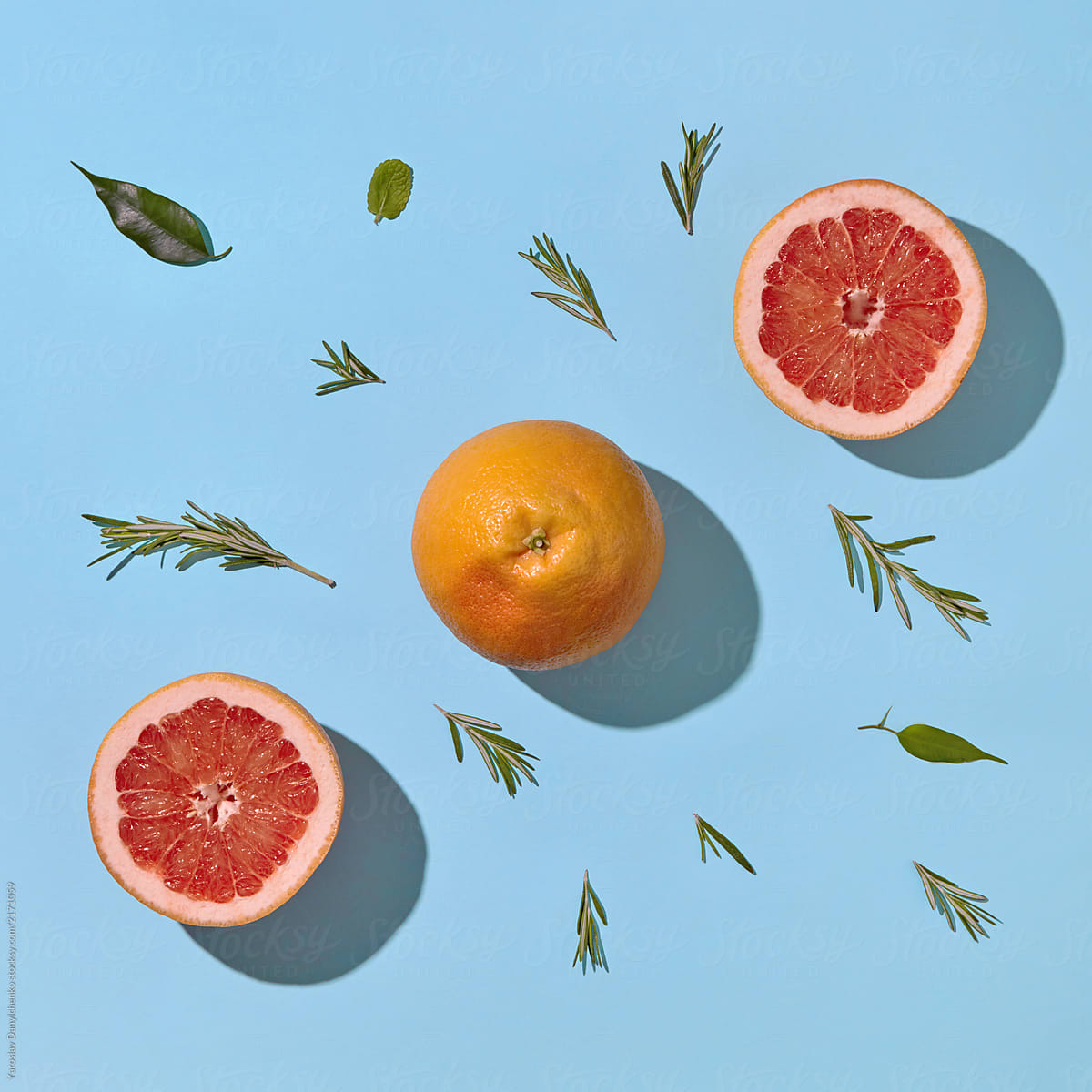 Top shot of pattern of citrus summer composition of whole and slices fruits