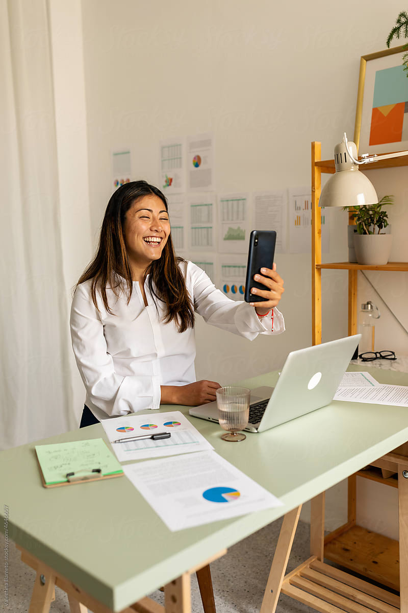 Businesswoman making video chat in office