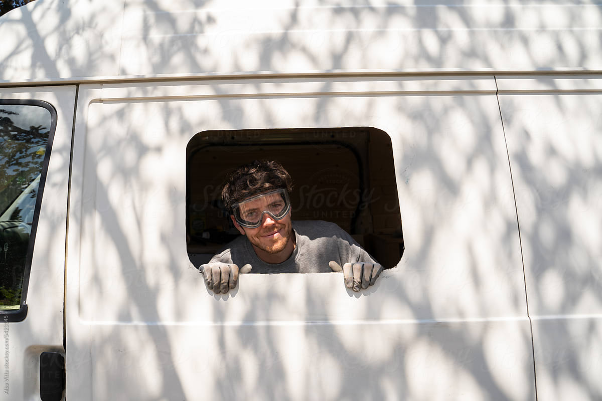 Image of man in new van window
