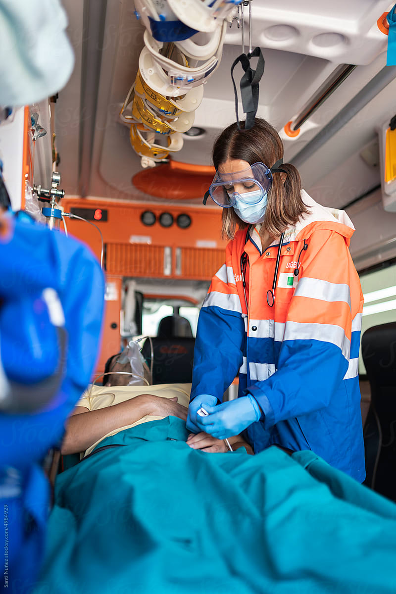 Paramedic woman working in ambulance