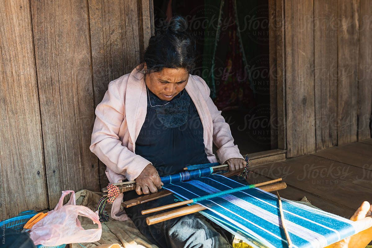 Asian woman weaving